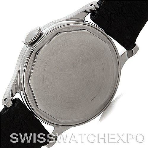 The image shows the back case and crown of a Vintage Patek Philippe watch at a slight angle.