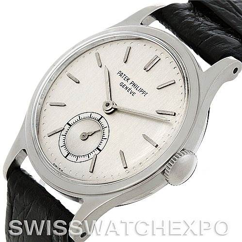 The image shows a side-angle view of a Patek Philippe Vintage 2451 Men's Stainless Steel Silver Dial 2451 Men's Stainless Steel Silver Dial watch highlighting the face, crown, and black leather strap.