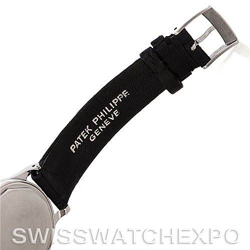 The image shows the side view of the strap and buckle of a Vintage Patek Philippe watch, focusing on the engraving on the strap.