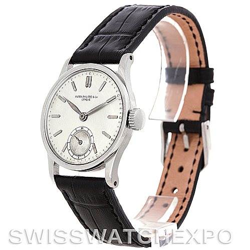 This image shows a side-angle view of the Vintage Patek Philippe watch displaying its face, crown, and black leather strap.