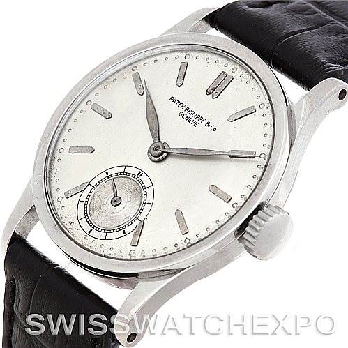 This angled view showcases the face and crown of the Vintage Patek Philippe watch with a leather strap.