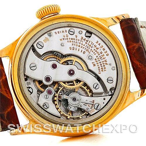 The image shows the back view of the movement and inner workings of a Vintage model watch by Patek Philippe.