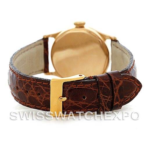 Rear view of the Patek Philippe Vintage 437 Men's Yellow Gold Silver Dial 437 Men's Yellow Gold Silver Dial watch featuring a brown leather strap and gold buckle.