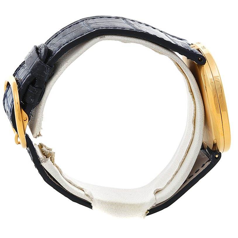 The image shows a side view of the Patek Philippe Golden Ellipse 3738 Men's Yellow Gold Blue Dial 3738 Men's Yellow Gold Blue Dial watch, highlighting the case, crown, and strap.