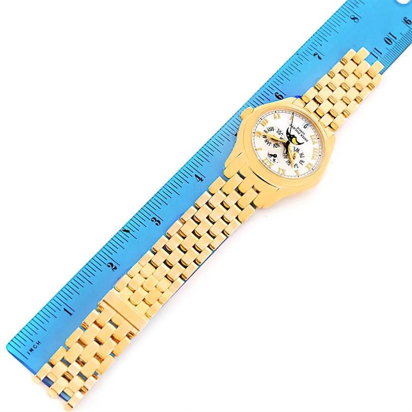 This image shows a top view of the Patek Philippe 5036 Men's Yellow Gold White Dial 5036 Men's Yellow Gold White Dial Annual Calendar Moonphase 18K Yellow Gold Watch 5036 model, including the case, dial, and bracelet.