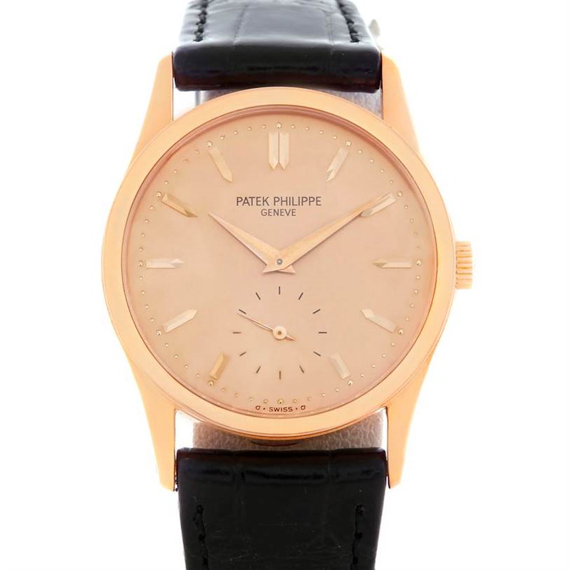 This image shows a front view of a Patek Philippe Calatrava watch, featuring a gold case, leather strap, and classic dial.