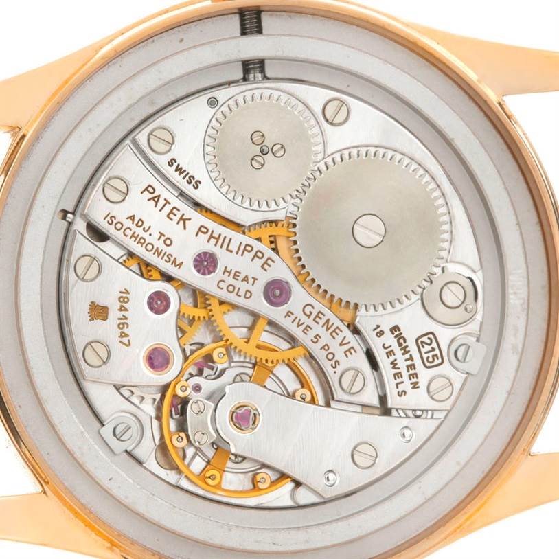 The image shows the intricate inner mechanism of a Patek Philippe Calatrava 3796 Men's Rose Gold Pink Dial 3796 Men's Rose Gold Pink Dial watch, viewed from the back.