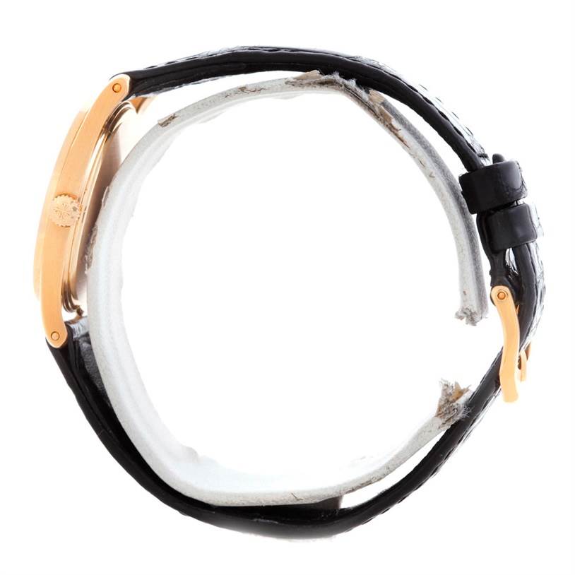 The image shows a side view of a Patek Philippe Calatrava 3796 Men's Rose Gold Pink Dial 3796 Men's Rose Gold Pink Dial watch, highlighting the crown, case, and black leather strap.