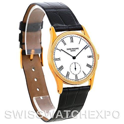 This image shows a side angle of the Patek Philippe Calatrava 3796 Men's Yellow Gold White Dial 3796 Men's Yellow Gold White Dial watch, displaying its face, case, and leather strap.