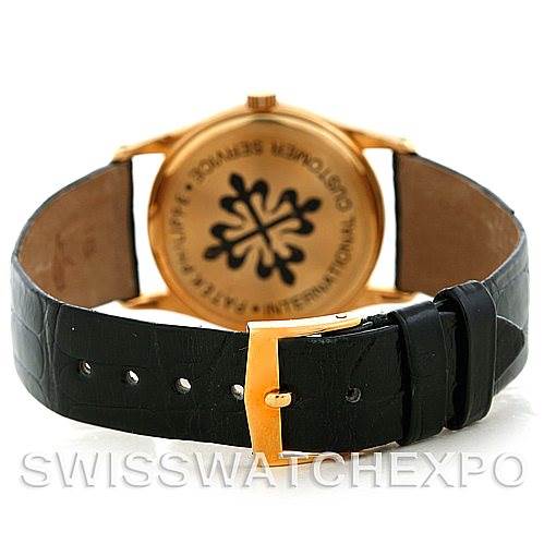 The image shows the back view of a Patek Philippe Calatrava 3796 Men's Yellow Gold White Dial 3796 Men's Yellow Gold White Dial watch, displaying the clasp and leather strap.