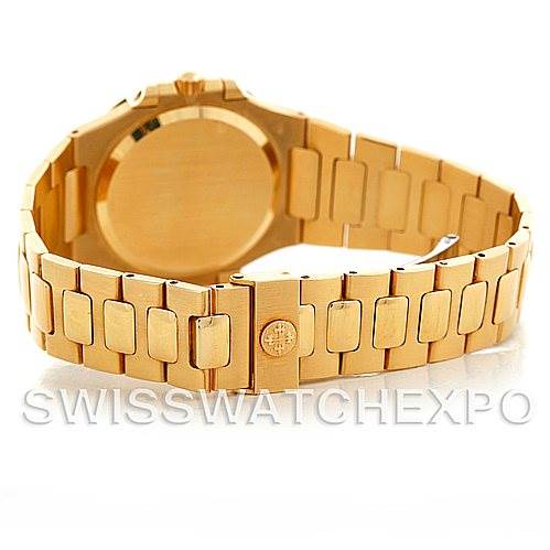 The image shows the back case and bracelet of a Patek Philippe Nautilus 3900/1J Men's Yellow Gold Champagne Dial 3900/1J Men's Yellow Gold Champagne Dial watch, highlighting the gold finish and clasp.