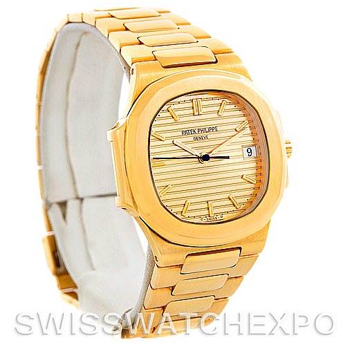 The image shows a Patek Philippe Nautilus 3900/1J Men's Yellow Gold Champagne Dial 3900/1J Men's Yellow Gold Champagne Dial watch at a slight left angle, highlighting its gold case, bracelet, and dial.