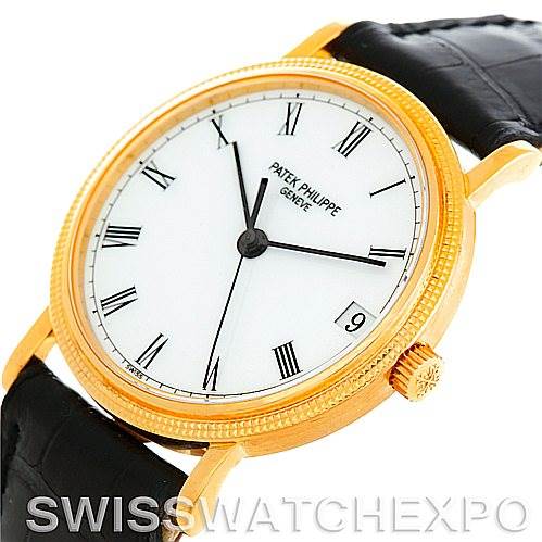 This Patek Philippe Calatrava 3802 Men's Yellow Gold White Dial 3802 Men's Yellow Gold White Dial watch is shown at an angled view, highlighting the dial, crown, lugs, and part of the leather strap.