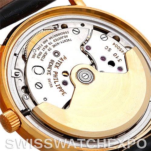 The image shows the back view of the movement of a Patek Philippe Calatrava 3802 Men's Yellow Gold White Dial 3802 Men's Yellow Gold White Dial watch, showcasing its intricate mechanical parts.