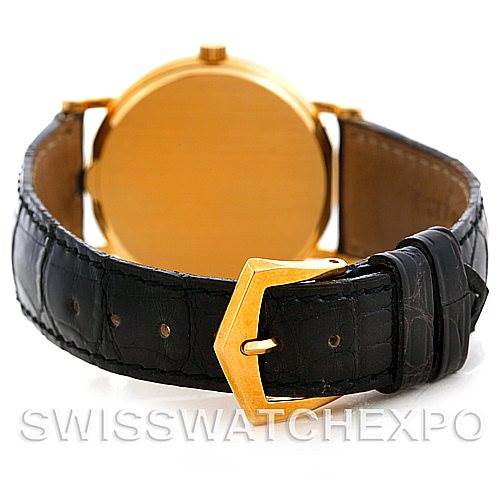 The image shows the back of a Patek Philippe Calatrava 3802 Men's Yellow Gold White Dial 3802 Men's Yellow Gold White Dial watch, focusing on its gold case and black leather strap with a gold buckle.