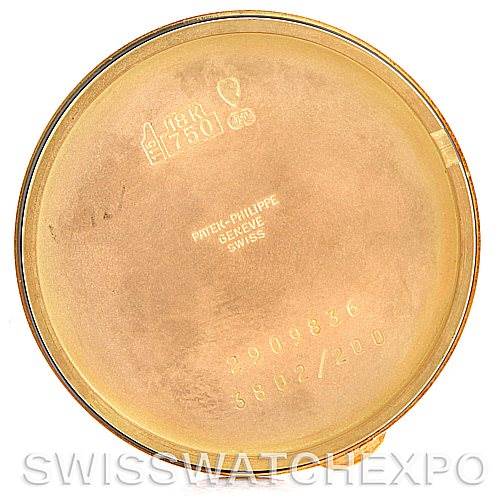 This image shows the inside case back of a Patek Philippe Calatrava 3802 Men's Yellow Gold White Dial 3802 Men's Yellow Gold White Dial watch, featuring inscriptions and markings.