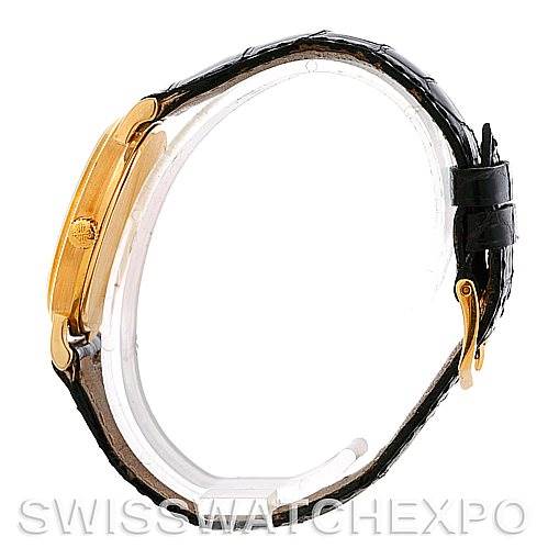 The image shows a side profile view of the Calatrava model by Patek Philippe, highlighting the case, crown, and strap.