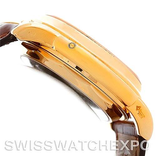 Side view of a Patek Philippe 3970 Men's Yellow Gold Silver Dial 3970 Men's Yellow Gold Silver Dial 18K Yellow Gold Perpetual Calendar Chronograph Watch, model 3970, showing the case and part of the strap.