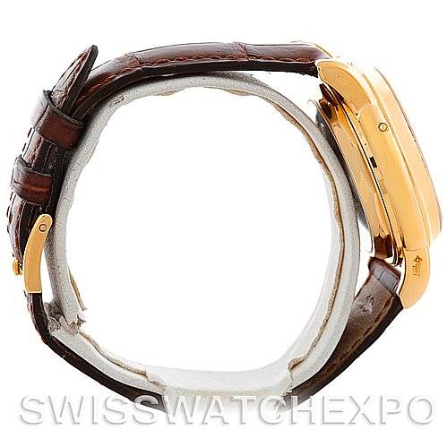 A side view of the Patek Philippe 3970 Men's Yellow Gold Silver Dial 3970 Men's Yellow Gold Silver Dial 18K Yellow Gold Perpetual Calendar Chronograph Watch 3970 model is shown with its brown leather strap.