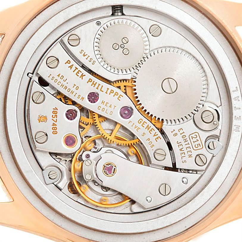 This image shows the internal mechanism of a Vintage Patek Philippe watch, focusing on the gears and jewels from the back angle.