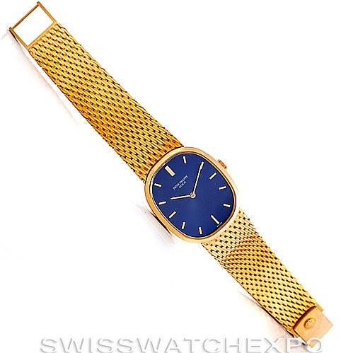 The image shows a top view of a Patek Philippe Golden Ellipse 3548/1 Men's Yellow Gold Blue Dial 3548/1 Men's Yellow Gold Blue Dial watch with a blue dial and a gold mesh bracelet.