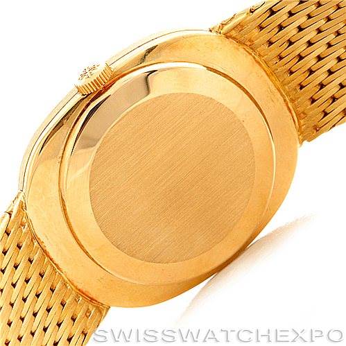 This image shows the back case and part of the bracelet of a Patek Philippe Golden Ellipse 3548/1 Men's Yellow Gold Blue Dial 3548/1 Men's Yellow Gold Blue Dial watch.
