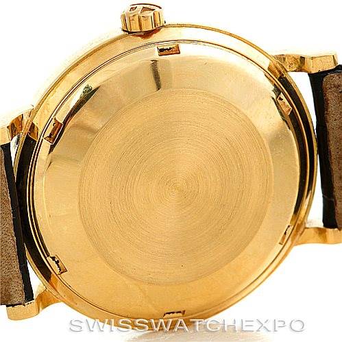 This image shows the back of a Vintage Patek Philippe watch, focusing on the gold case and its lugs.