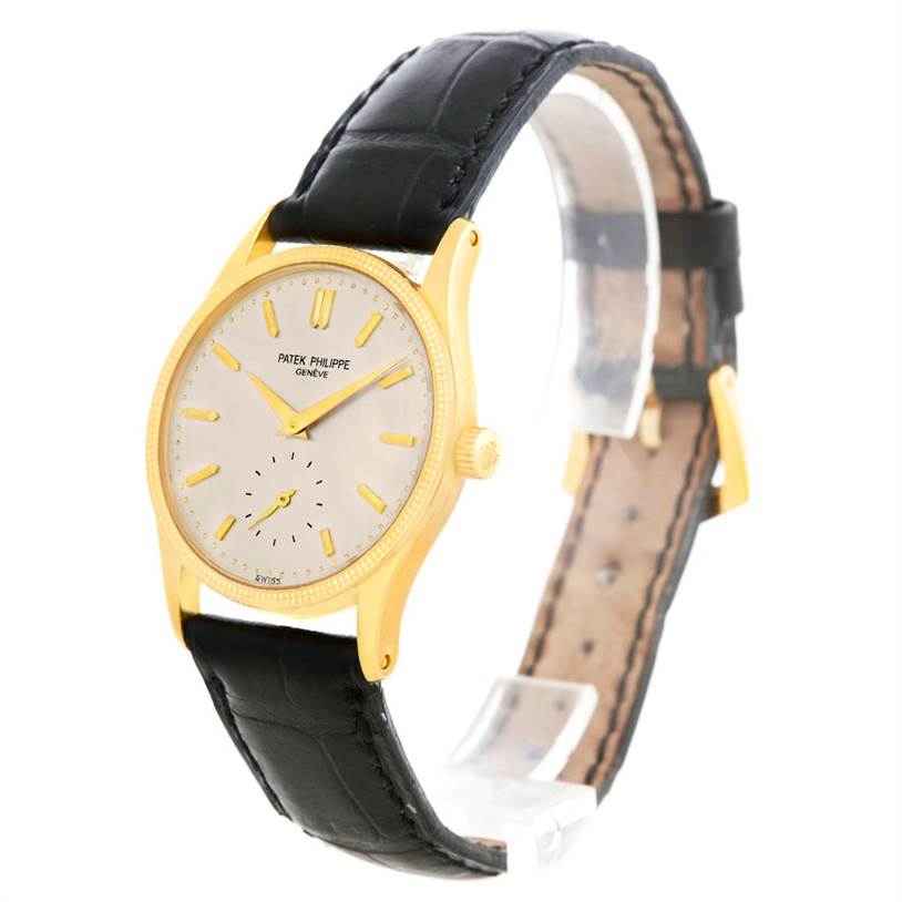 The Patek Philippe Calatrava 3796 Men's Yellow Gold Silver Dial 3796 Men's Yellow Gold Silver Dial model is shown at a three-quarter angle, displaying its face, bezel, side, and leather strap.