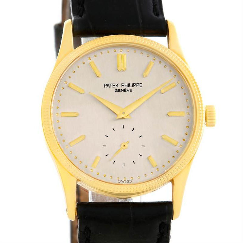 The image shows a front view of the Patek Philippe Calatrava watch, displaying the dial, hands, and leather strap.