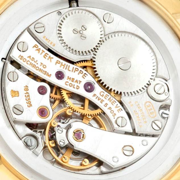 This photo shows a close-up of the movement and inner mechanism of a Patek Philippe Calatrava 3796 Men's Yellow Gold Silver Dial 3796 Men's Yellow Gold Silver Dial watch.