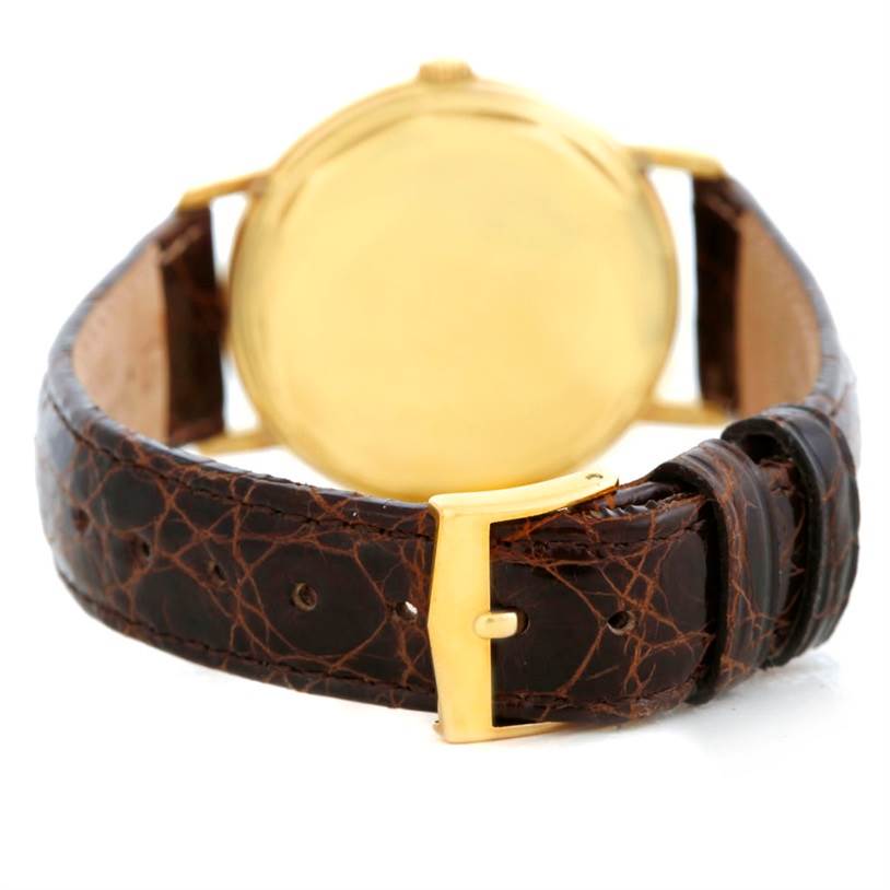 The image shows the back case and leather strap of a Vintage Patek Philippe watch, viewed from the rear angle.