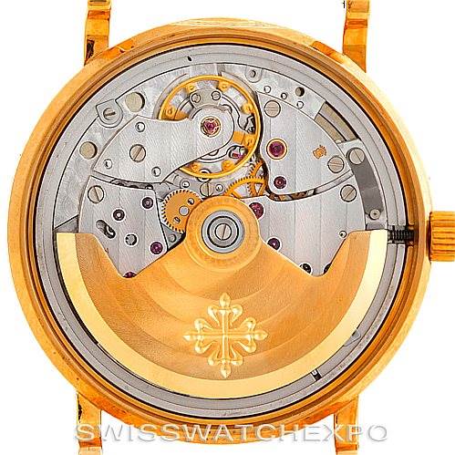 This image shows the intricate movement and inner workings from the back of a Patek Philippe Calatrava 3802 Men's Yellow Gold White Dial 3802 Men's Yellow Gold White Dial model watch.