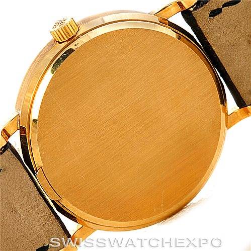The image shows a rear view of the Patek Philippe Calatrava 3802 Men's Yellow Gold White Dial 3802 Men's Yellow Gold White Dial watch case and crown, with the strap attached to the lugs.
