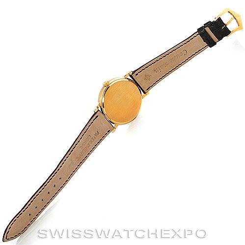 This image shows the back view of a Patek Philippe Calatrava 3802 Men's Yellow Gold White Dial 3802 Men's Yellow Gold White Dial watch, displaying the case back and the leather strap.