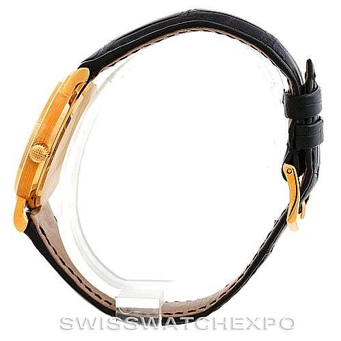 The image shows a side view of a Patek Philippe Calatrava 3802 Men's Yellow Gold White Dial 3802 Men's Yellow Gold White Dial watch, highlighting its case, crown, and leather strap.