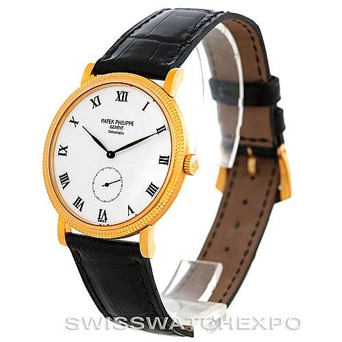 This image displays a Patek Philippe Calatrava 3919 Men's Yellow Gold White Dial 3919 Men's Yellow Gold White Dial watch at an angled side view, showing its face, bezel, and leather strap.