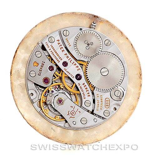 This image shows a top-down view of the intricate mechanism of a Patek Philippe Calatrava 3919 Men's Yellow Gold White Dial 3919 Men's Yellow Gold White Dial watch movement.