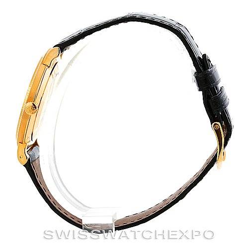 This image shows a Patek Philippe Calatrava 3919 Men's Yellow Gold White Dial 3919 Men's Yellow Gold White Dial watch from a side profile, highlighting the gold case and black leather strap.