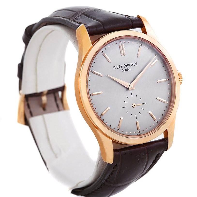 The image shows a Patek Philippe Calatrava 5196R Men's Rose Gold Silver Dial 5196R Men's Rose Gold Silver Dial watch at a three-quarter angle, highlighting its dial, case, and leather strap.