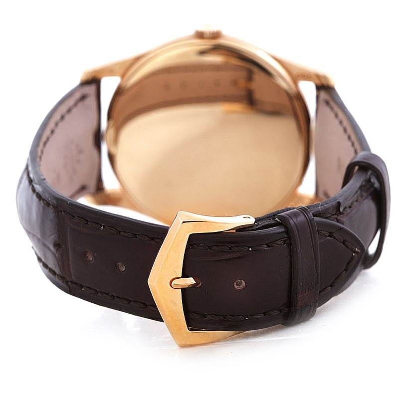 The image shows the back of the Patek Philippe Calatrava 5196R Men's Rose Gold Silver Dial 5196R Men's Rose Gold Silver Dial watch, highlighting its leather strap and gold buckle.