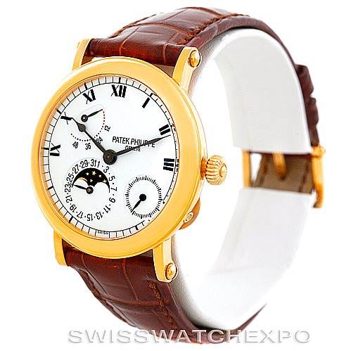 The image shows a Patek Philippe Complications 5054 Men's Yellow Gold White Dial 5054 Men's Yellow Gold White Dial model watch, angled to display the face, crown, lugs, and leather strap.