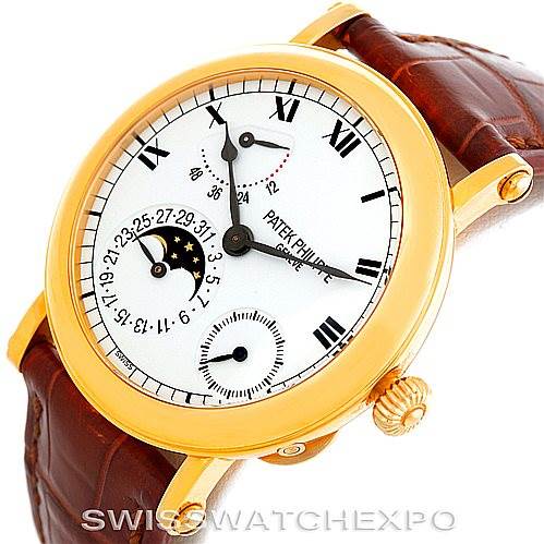 The image shows a Patek Philippe Complications 5054 Men's Yellow Gold White Dial 5054 Men's Yellow Gold White Dial watch at an angle displaying its face, crown, and brown leather strap.