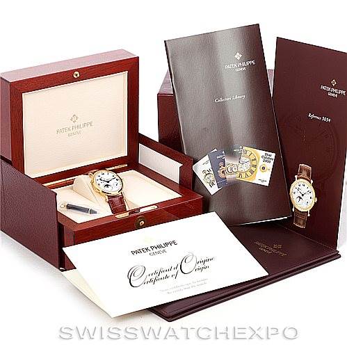 The image shows the Patek Philippe Complications 5054 Men's Yellow Gold White Dial 5054 Men's Yellow Gold White Dial watch, its box, manuals, certificate of origin, and additional documentation.