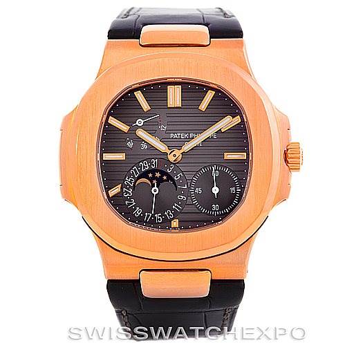 The image shows a front view of a Patek Philippe Nautilus 5712R Men's Rose Gold  5712R Men's Rose Gold  watch, featuring its dial, hands, subdials, and a leather strap.