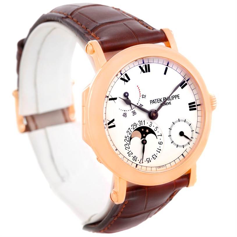 The Patek Philippe 5054 Men
s Rose Gold White Dial 5054 Men
s Rose Gold White Dial Power Reserve Moonphase Rose Gold Watch 5054 is shown from a front angle, displaying the face, case, and leather strap.
