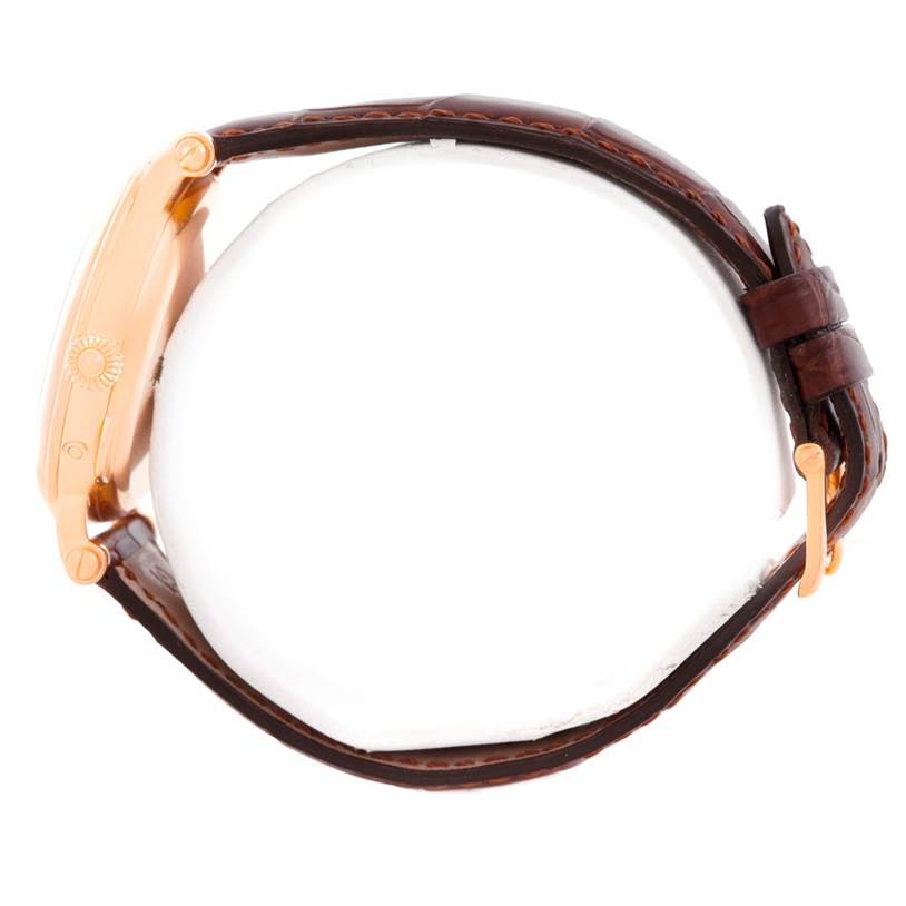 This image shows the side view of a Patek Philippe 5054 Men
s Rose Gold White Dial 5054 Men
s Rose Gold White Dial Power Reserve Moonphase Rose Gold Watch 5054 Papers model, highlighting the watch case and strap.