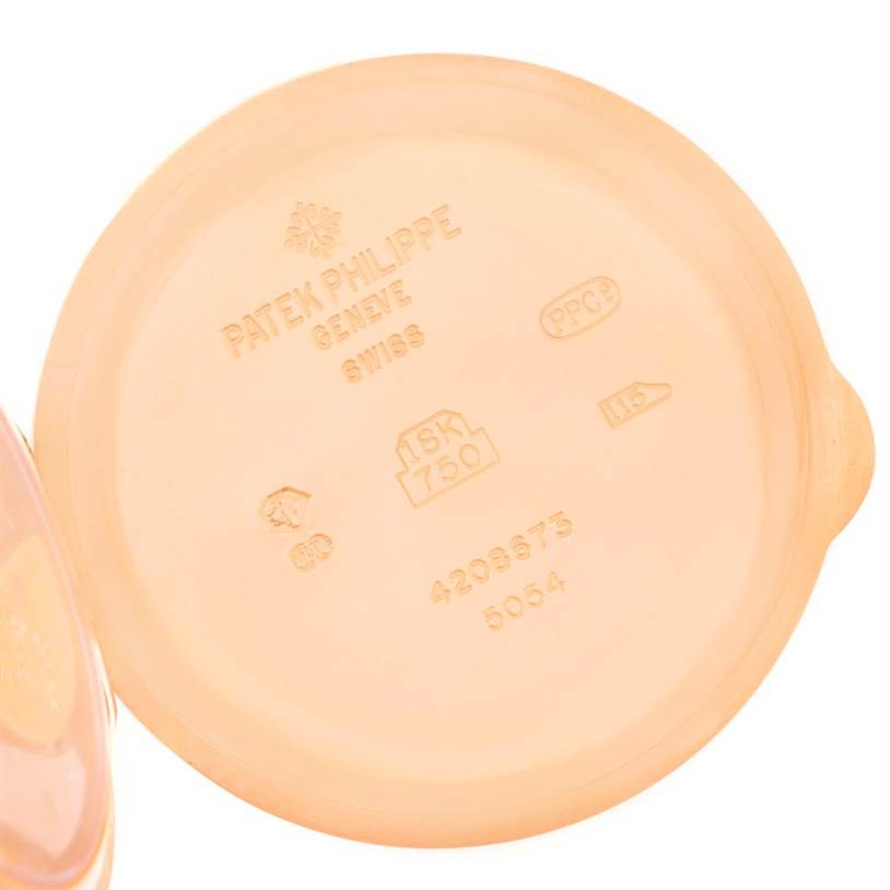 The image shows the inside case back of the Patek Philippe 5054 Men
s Rose Gold White Dial 5054 Men
s Rose Gold White Dial Power Reserve Moonphase Rose Gold Watch 5054, displaying engravings and hallmarks.