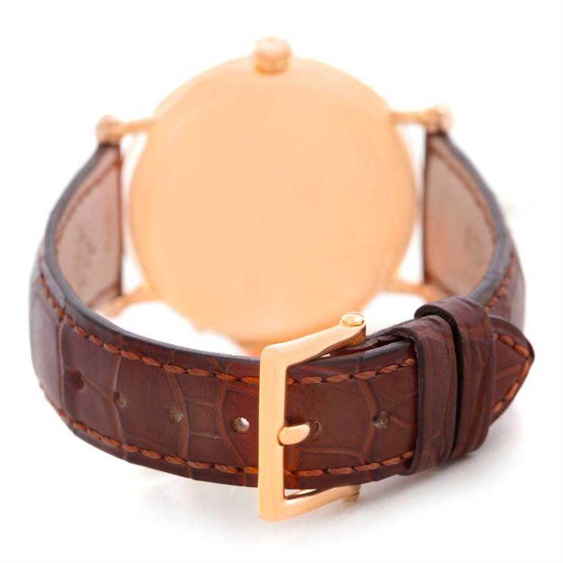 The image shows the back view of the Patek Philippe 5054 Men
s Rose Gold White Dial 5054 Men
s Rose Gold White Dial Power Reserve Moonphase Rose Gold Watch 5054 Papers, highlighting the strap and buckle.