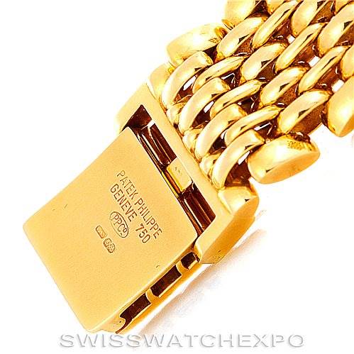 This image shows a close-up of the gold clasp and bracelet of a Patek Philippe Calatrava 3998 Men's Yellow Gold Silver Dial 3998 Men's Yellow Gold Silver Dial watch.