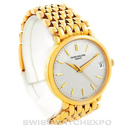 This image shows a Patek Philippe Calatrava 3998 Men's Yellow Gold Silver Dial 3998 Men's Yellow Gold Silver Dial watch from an angled view, highlighting its gold case, bracelet, and dial with a date window.